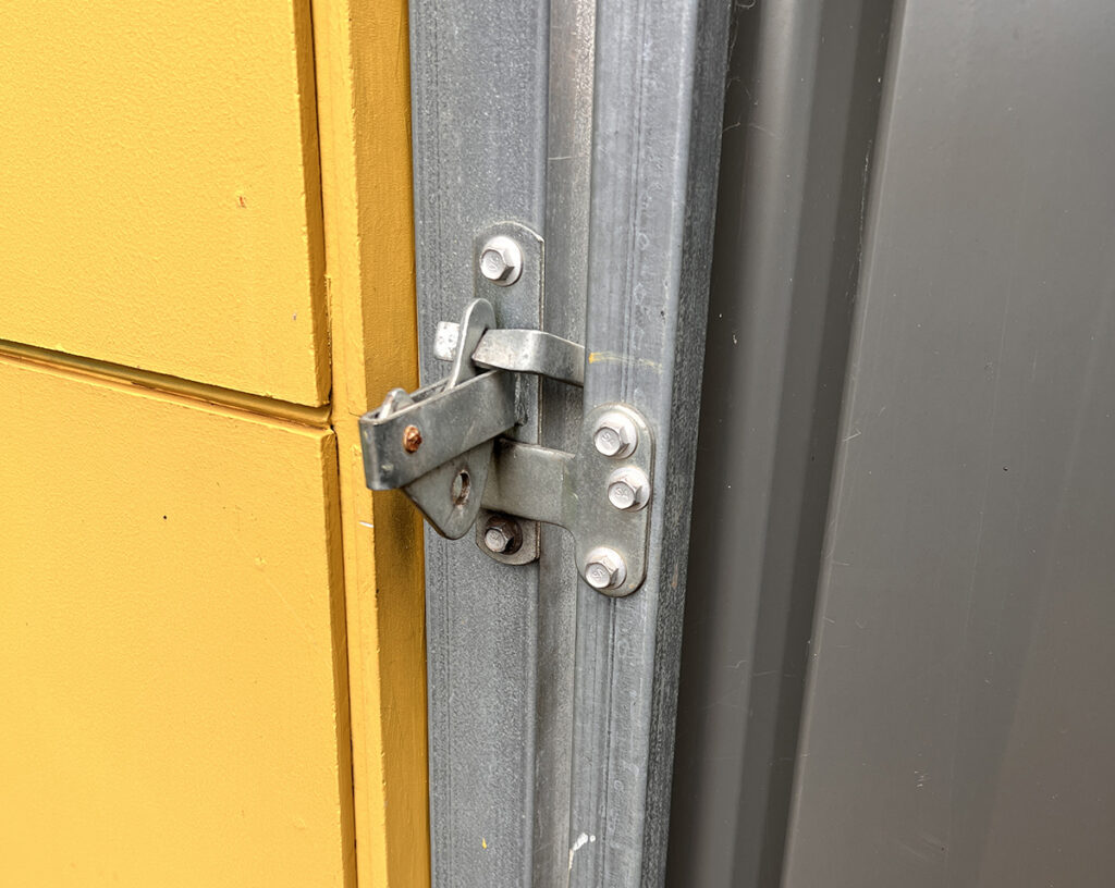 Mitch Vahldieck -- padlock missing from the side gate. The side gate gives access to the rear of the house and carport. 
