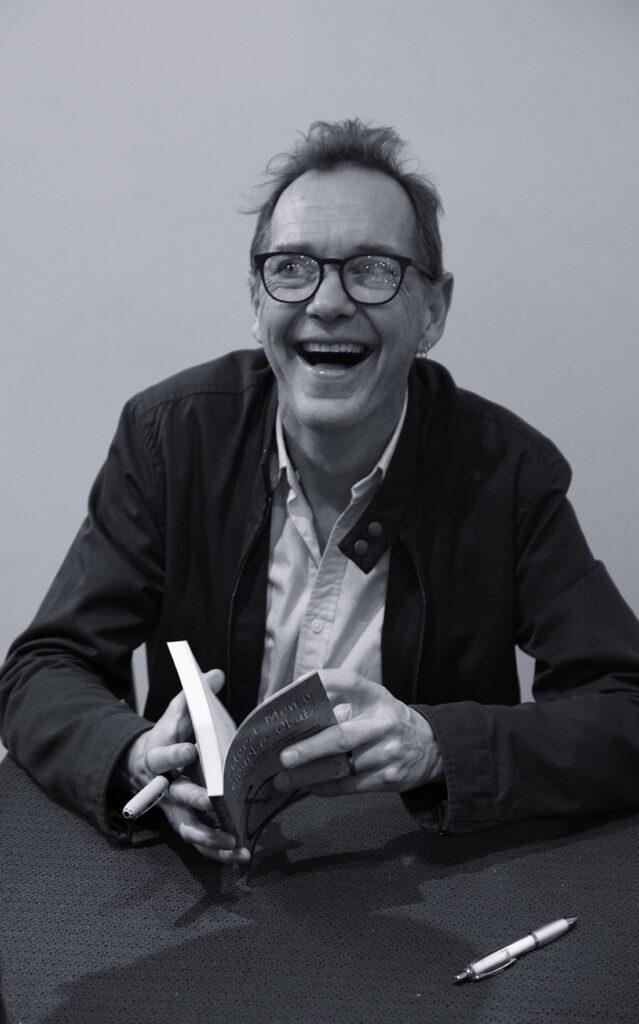 Dr Pete Court enjoying a joke with a friend at the launch of Pete's latest book, 'The Used Men's Bicycle Club'