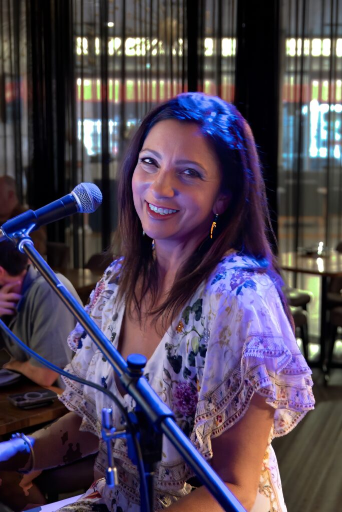 Becky Blake with a smile that could launch a thousand ships and break a thousand hearts. Photo by Lee Hopkins, leehopkins.com/events