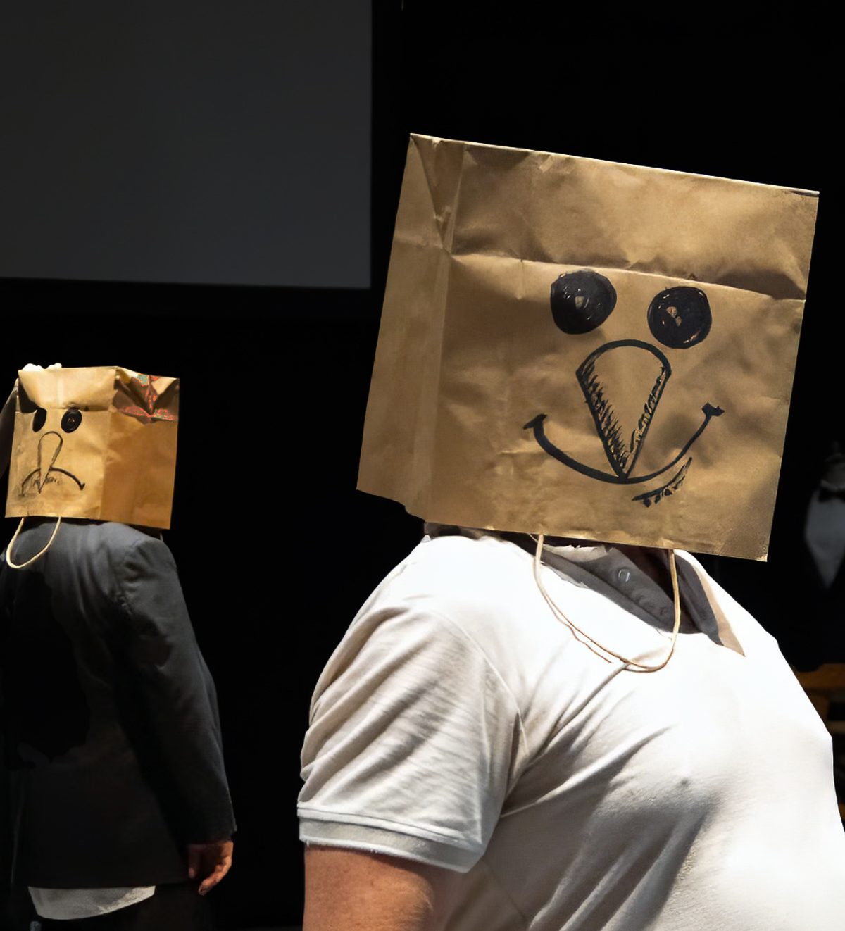 Two men with paper bags on their heads