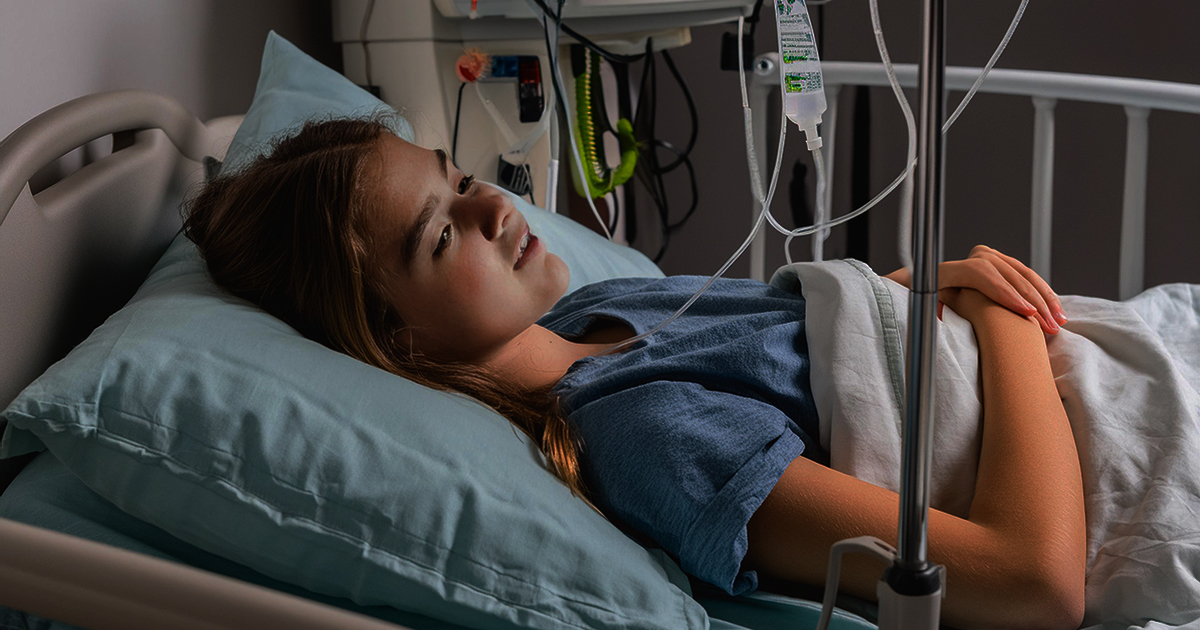 Rachel Millward, teen daughter of Lauren and Brett Millward, very sick and in a hospital bed